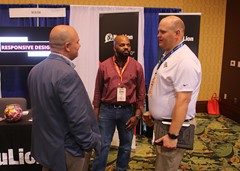 CoSIDA members mingling in the exhibit hall.